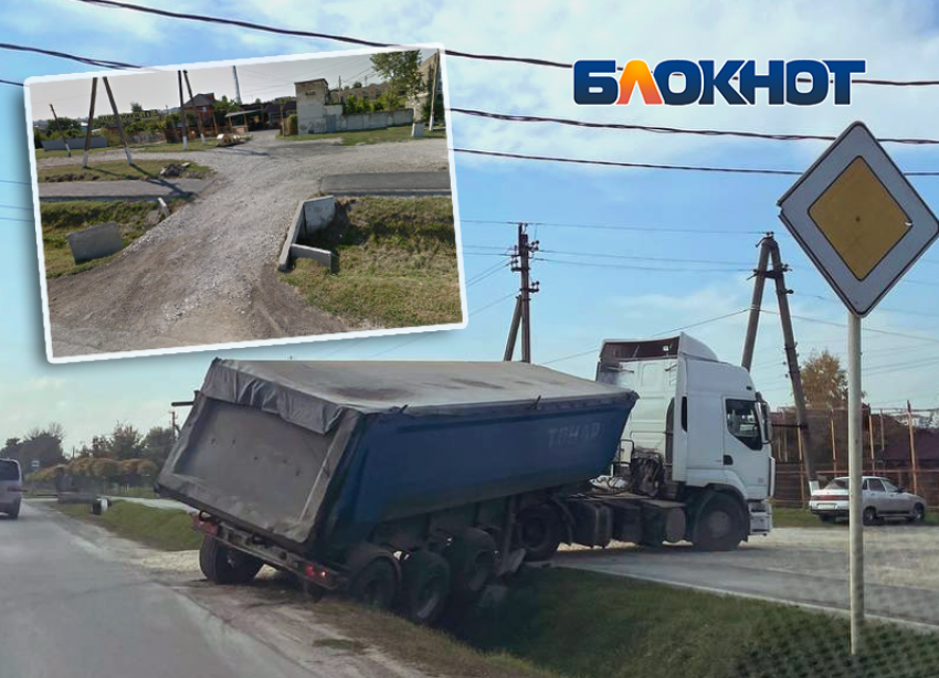 В Крымске на улице Луначарского большегруз не вписался в поворот и застрял в ливневке